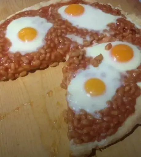 Pizza with bean and fried eggs