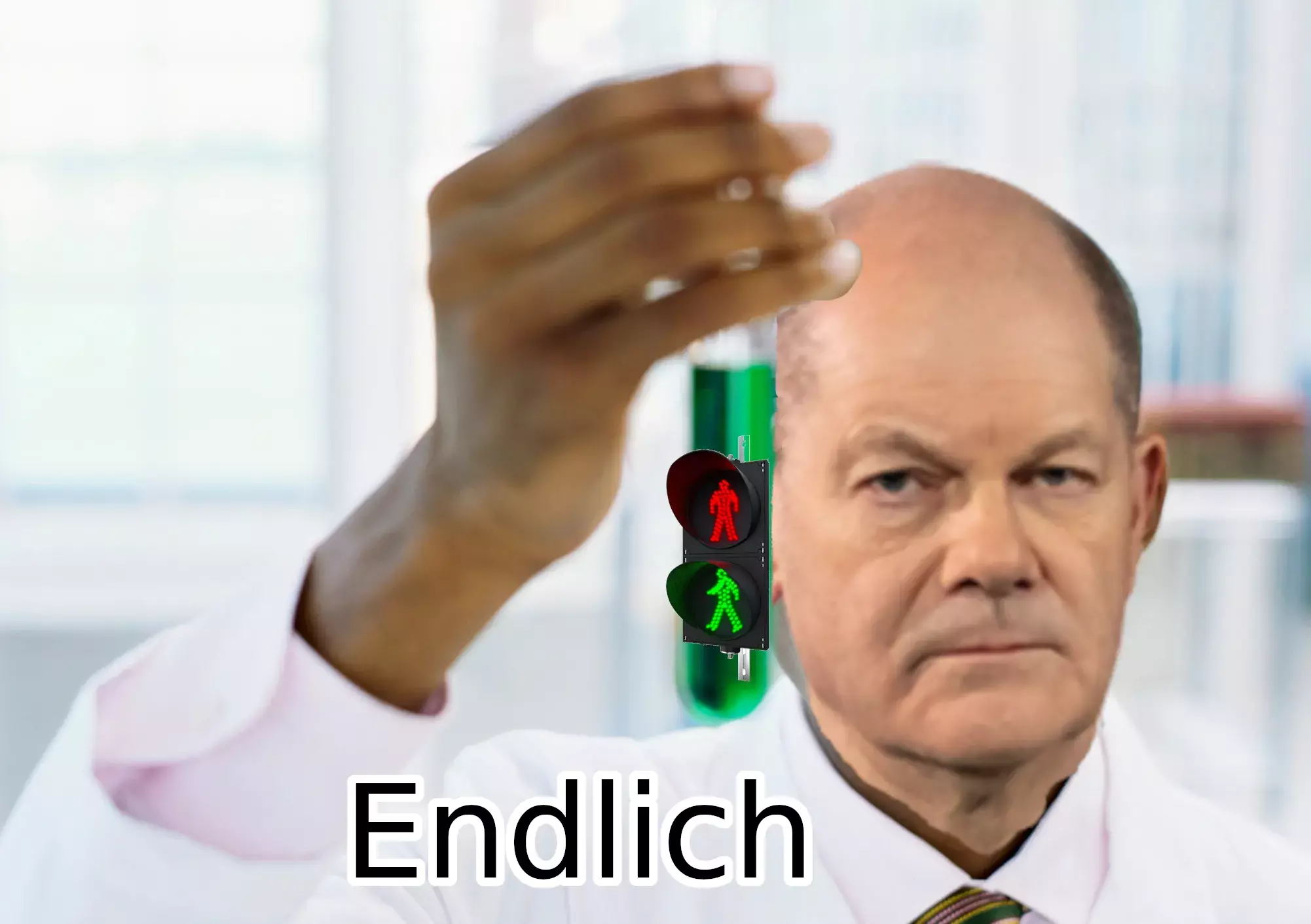 Olaf Scholz hält ein Reagenzglas mit einer Fußgängerampel (kein Gelb). Beschriftung: "Endlich"