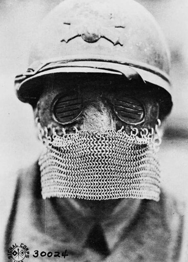 French tanker wearing a British 'splatter mask' to protect against shrapnel/'spalling' in the tank, WW1, 1918